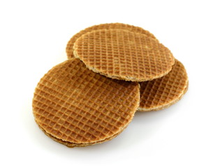 Stack of Dutch stroopwafel cookies or caramel waffles isolated on white.