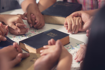 Christians  and Bible study concept. Group of discipleship Studying the Word Of God in church and...