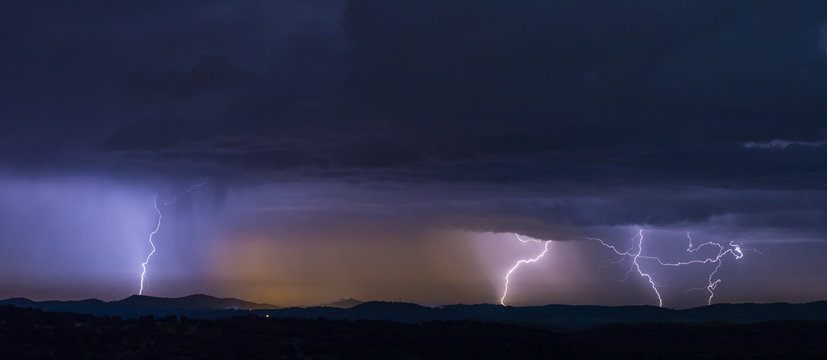 Powerful thunderstorm over hills