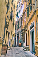 Narrow Italian pathway between buildings
