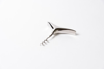 Stylish metalic corkscrew on a white background