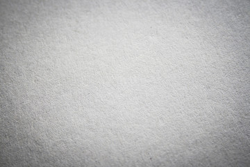 white cardboard texture or background with dark vignette borders