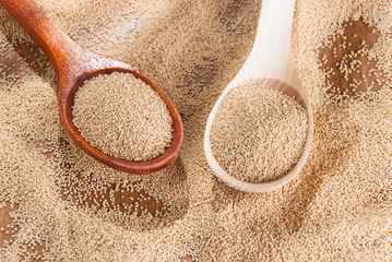 Raw Organic Amaranth grain on wooden table