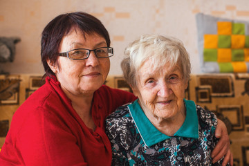 Elderly woman with her adult daughter.