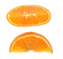 Two slices of tangerine isolated on white background. Top view. Flat lay