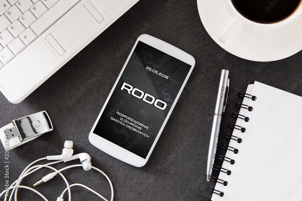 Poster smartphone lies on desk with rodo sign on display. conception of general data protection regulation 