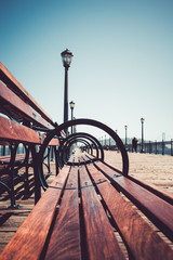 Fototapeta premium Closeup of bench in San Francisco. Vanishing point