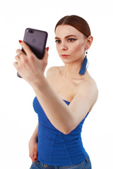 Portrait of a cheerful woman taking selfie