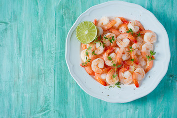 boiled shrimps on wooden surface
