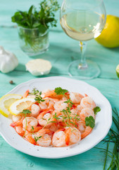 boiled shrimps on wooden surface