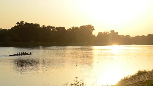 Jarun lake near Zagreb, Croatia. Sport and recreation. Rowing, kayak and canoe. Rowing team training at sunset