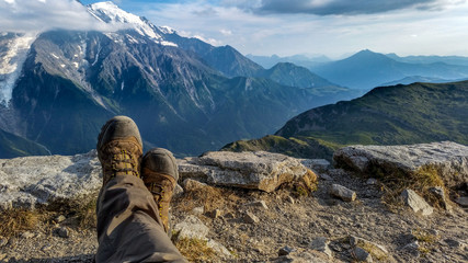 legs with alps background