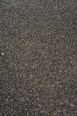 Pattern of black flickering volcanic sand texture. Cape Verde. background