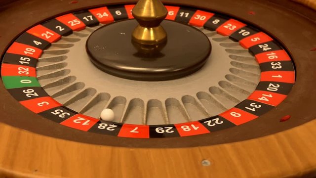Close up of roulette wheel spinning slowly and then it stops moving