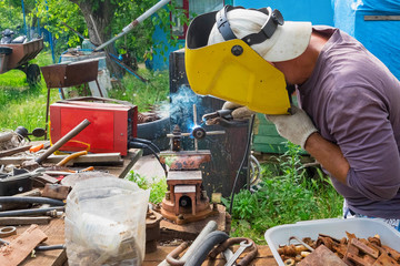 Home Welding of metal instruments. Use of a vice and welding machine, safe work in a mask