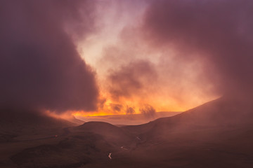 Fototapeta na wymiar Purple sunset over highlands.