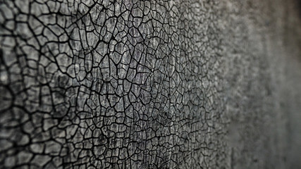 Background from old weathered faded cardboard with a relief from cracks