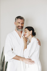 Couple relaxing with golden eye mask treatment