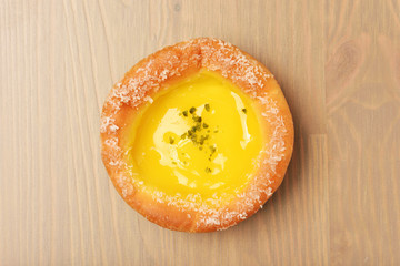 Lemon cheese brioche on the wooden table