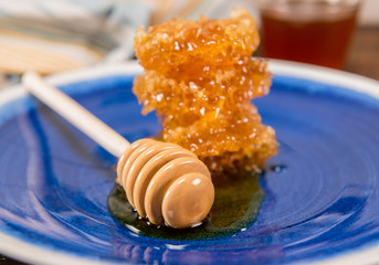 Honey Dipper and Stack of Honey Comb