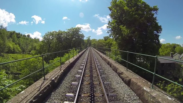 Transpportation: POV shot of a train going over a bridge