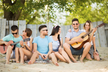 Young group of people outdoors on the beach
