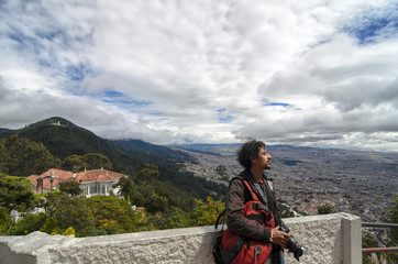 Man catching wind and sun above Bogota city