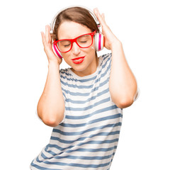 young pretty woman listening music with a headphones