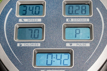 The display panel on the exercise machine. The display shows speed, time, distance and burned...