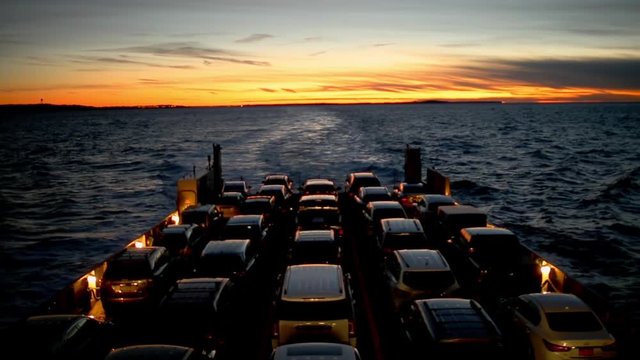 Ferry Full of Cars Crosses the Long Island Sound During Sunset Centered in Frame