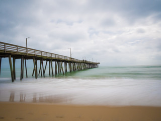Fototapeta na wymiar Long exposure of the fishing pier and Atlantic Ocean, in Virginia Beach, Virginia.