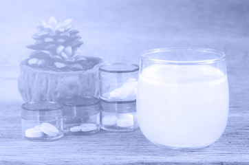 oral medication on wood background with soft light.