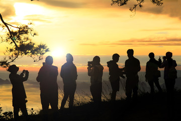 Fototapeta premium People enjoyed sunrise at the mountain top.