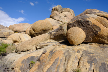 Smooth round boulders among The Amazing Weathered Granite rocks of Alabama Hills due to various geological factors