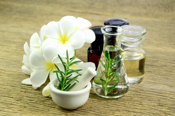 Obraz na płótnie Canvas Rosemary and essential oil for homeopathy remedy.
