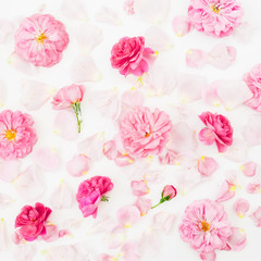 Pink roses flowers and petals on white background. Flat lay, Top view. Flower texture.