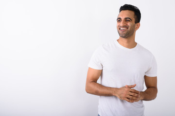 Young handsome Indian man against white background