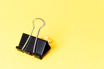 binder clip on colorful background