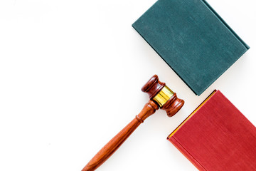 Law student concept. Judge gavel and vintage books on white background top view copy space