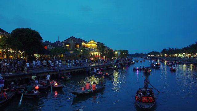 Quang Nam, Vietnam - NOV 2017: Night river view with floating lanterns and boats in Hoi An old town. Hoi An is UNESCO world heritage, one of the most popular destinations in Vietnam
