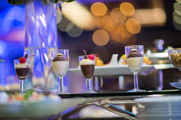 Glass shots pastry, wedding catering food, mini canapes food, tasty dessert, Beautiful decorate catering banquet table,  snacks and appetizers, wedding celebration