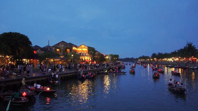 Quang Nam, Vietnam - NOV 2017: Night river view with floating lanterns and boats. Hoi An, once known as Faifo. Hoian is a city in Quang Nam and noted since 1999 as a UNESCO World Heritage Site