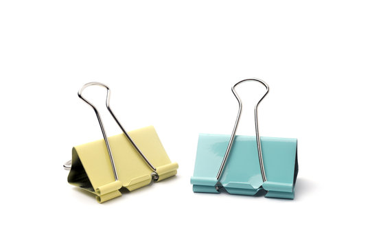Yellow and blue Binder clip on a white background.
