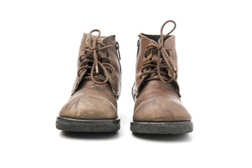 old brown boots isolated on a white background.