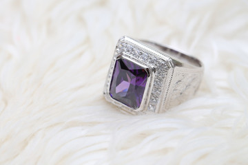 purple gemstone on diamond ring