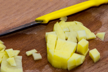 Peeled potato cutted on the small slices