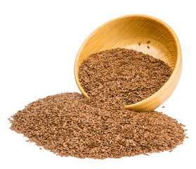 flax seeds in a wooden cup isolated on a white background