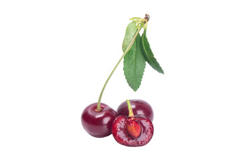 red cherry on a branch with a green leaf, cut in the middle to the bone, isolated on a white...