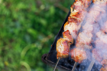 Preparation of shish kebab from pork, top view. Brazier with space for text