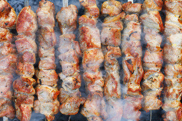 Shish kebab from pork. Background of cooked meat, top view